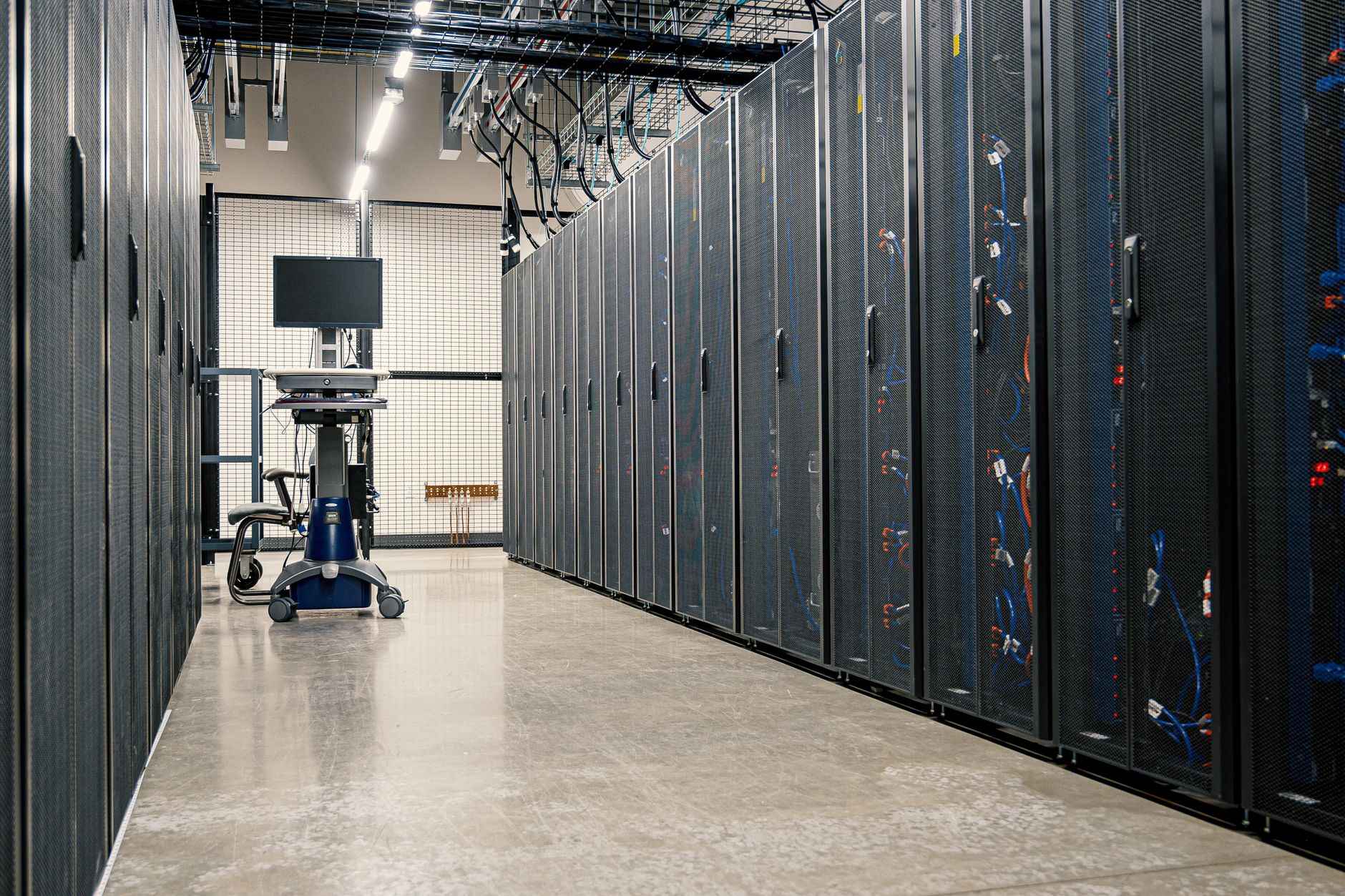 Server room with networking equipment representing bitcoin mining hardware that needs insurance protection