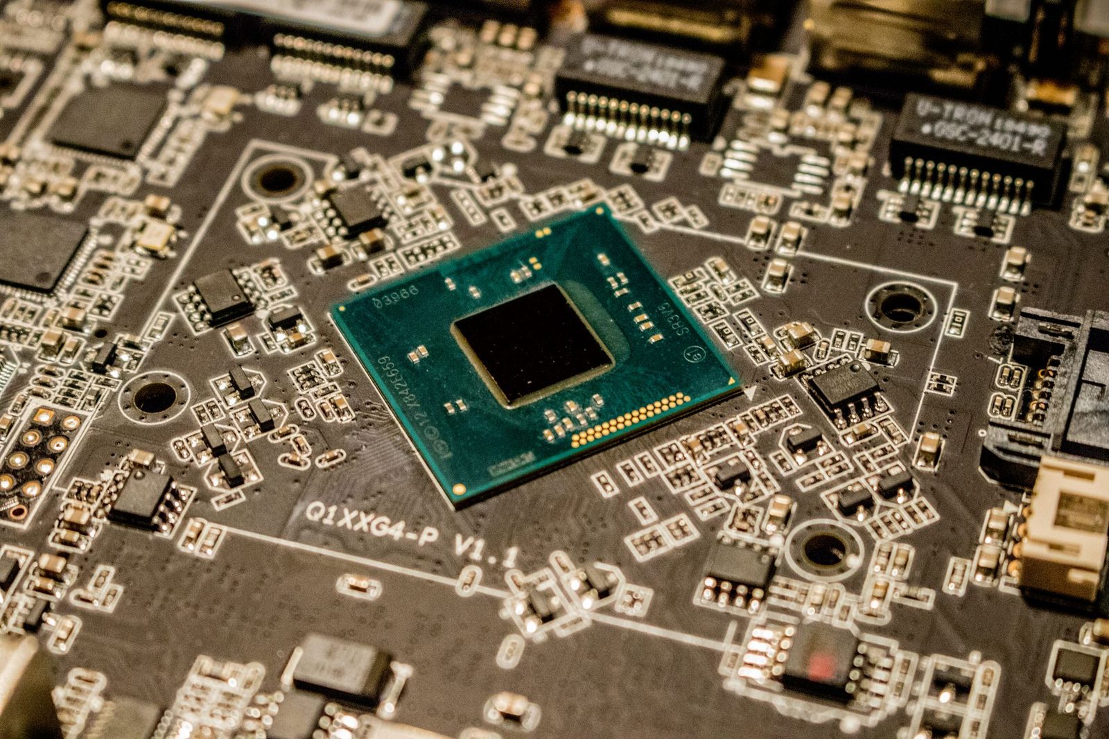 Close-up of a microchip on a printed circuit board showcasing mining hardware components