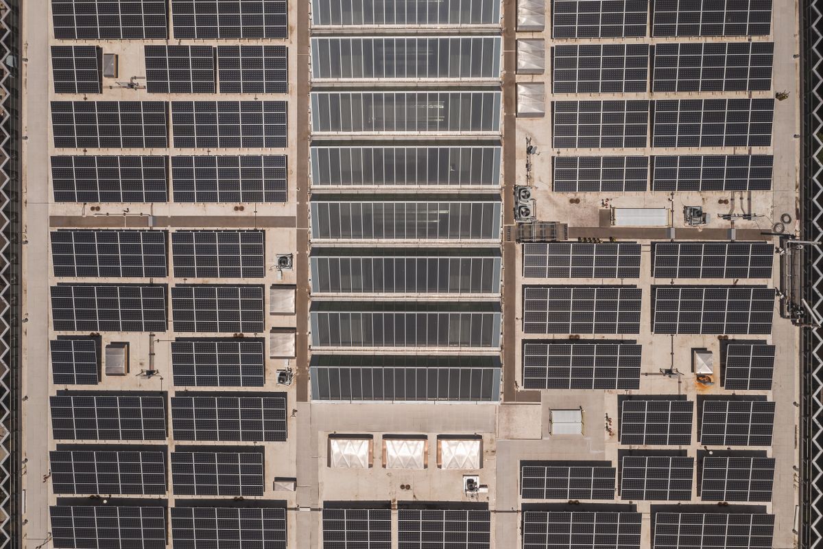 Aerial view of solar panels representing renewable energy for Bitcoin mining operations