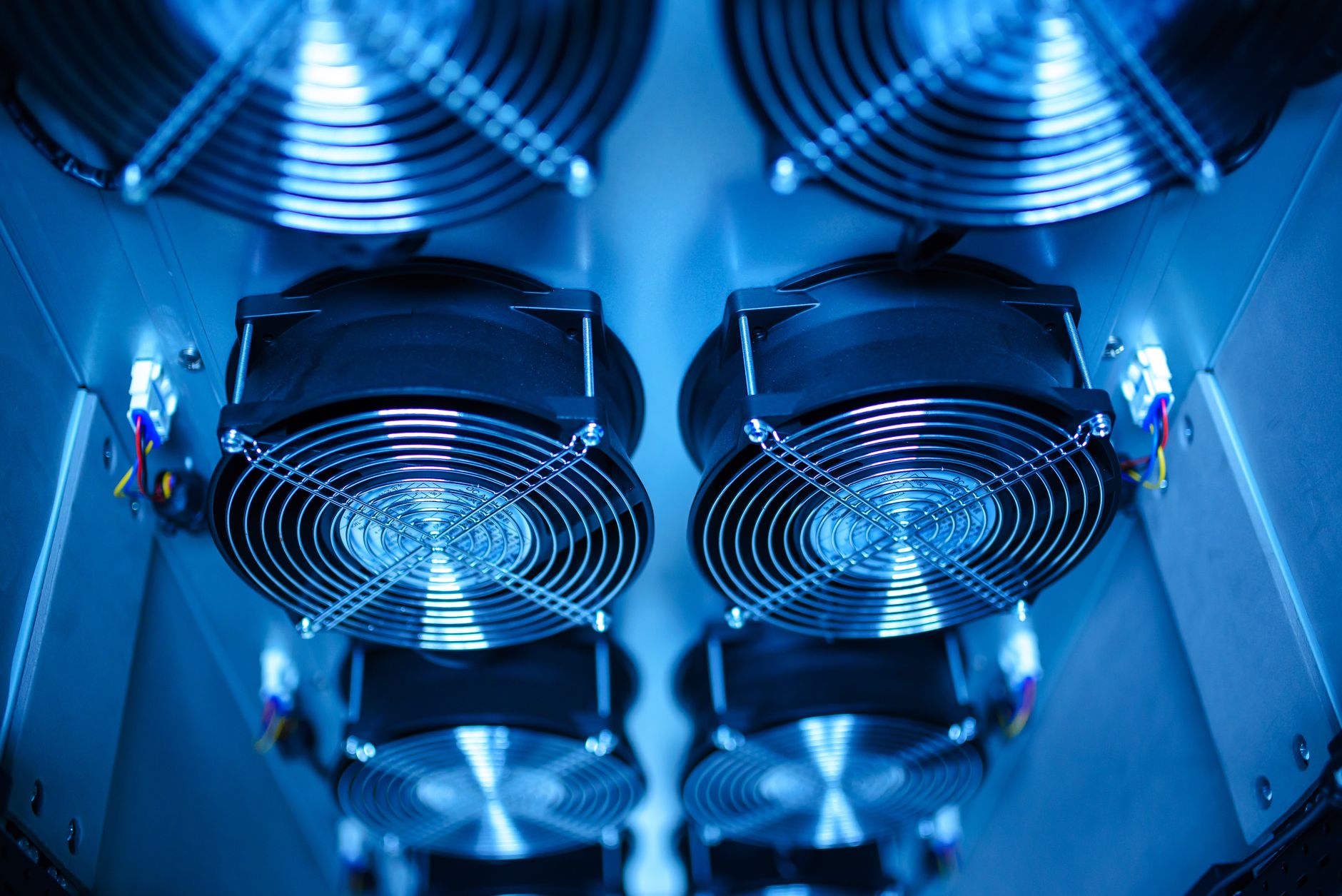 Close-up of cooling fans in a server room, showcasing techno