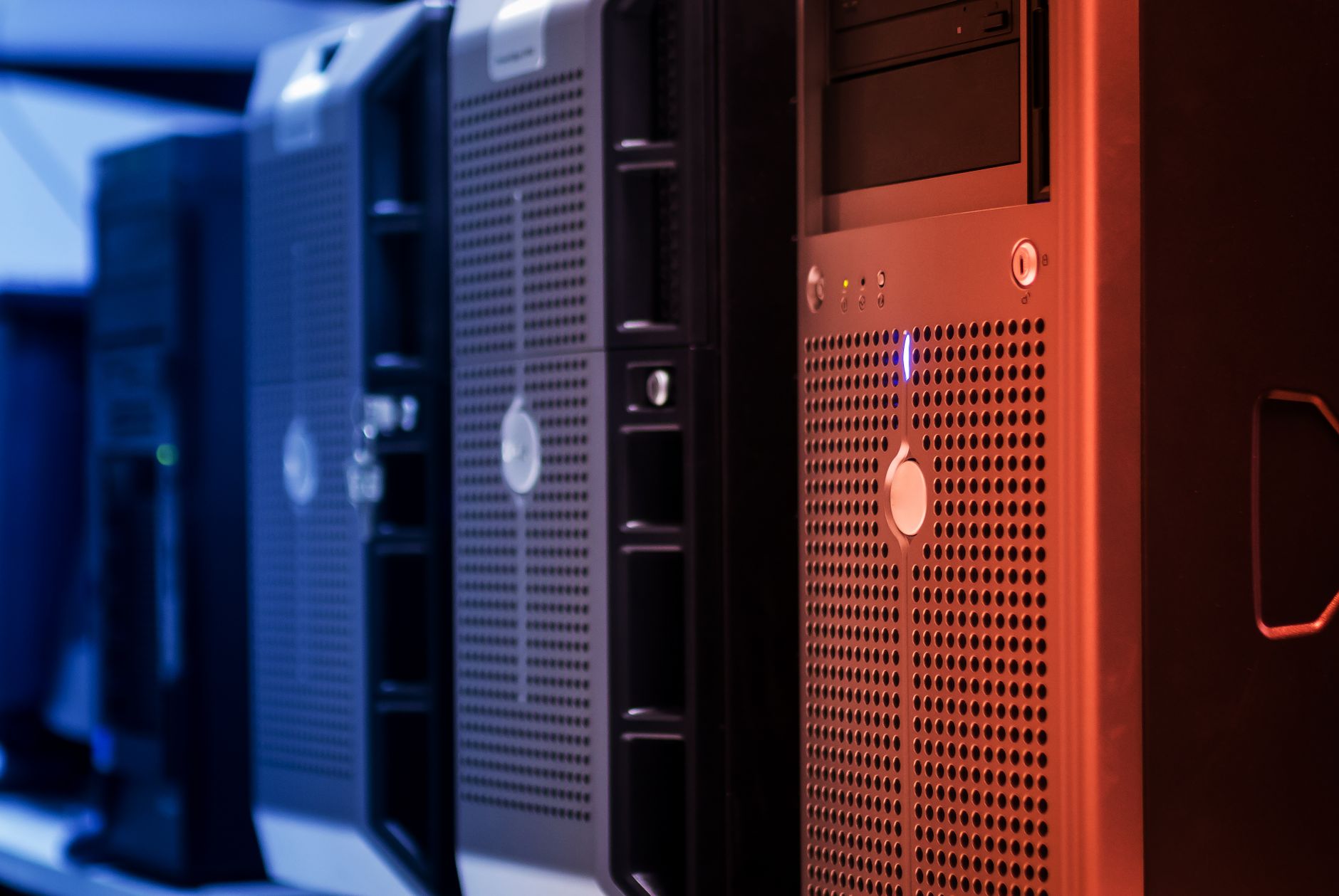 Close-up of tower servers in a data center with blue and red