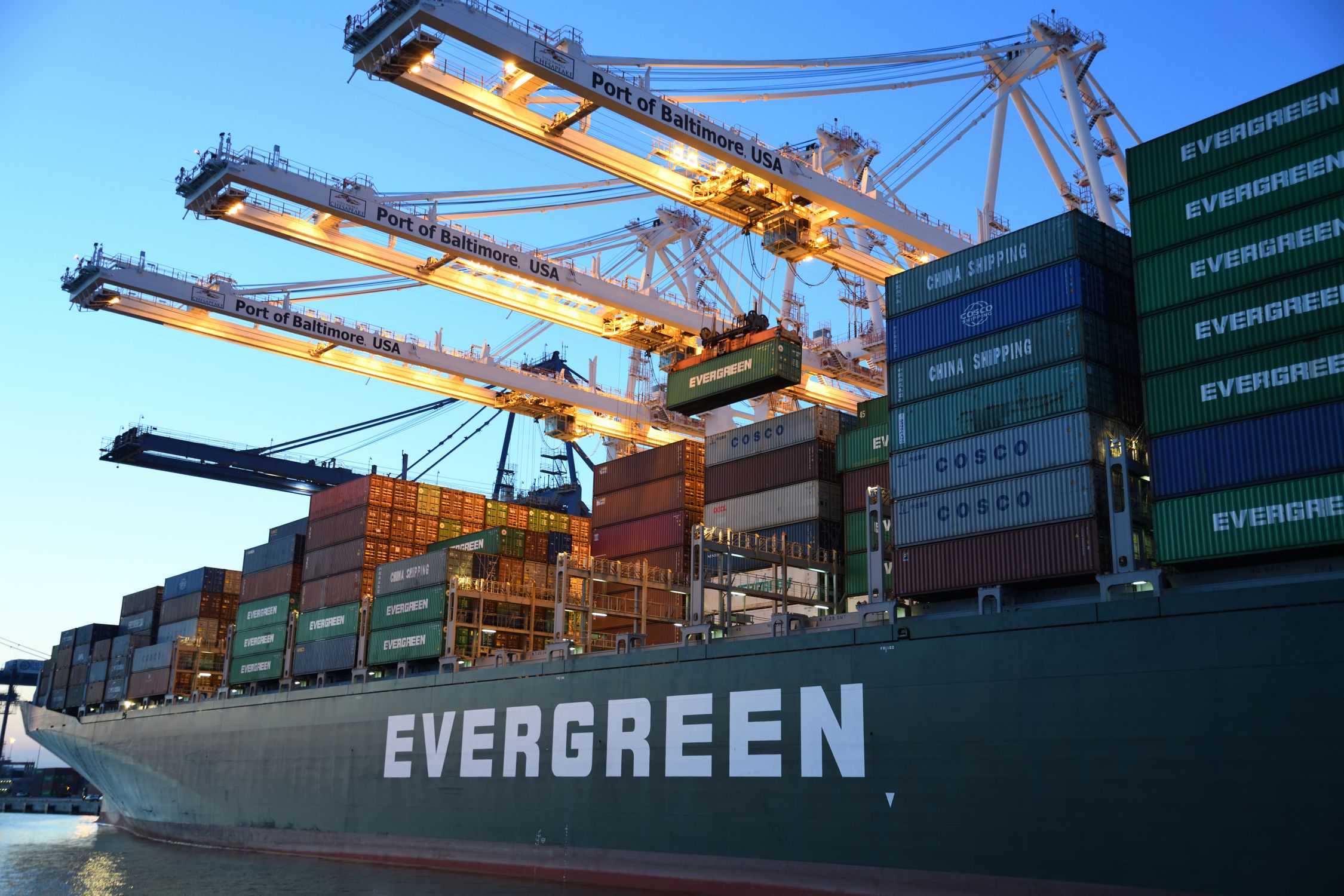 Shipping containers at port representing international trade and tariffs - Rax Mining