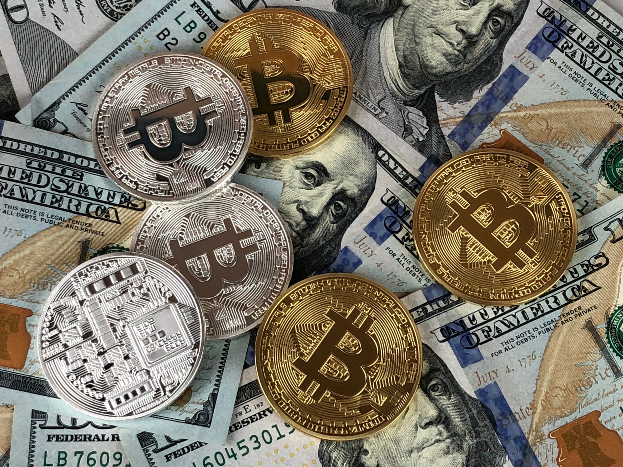 Bitcoin cryptocurrency coins representing mining investment decisions - Rax Mining