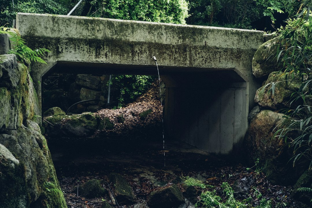 Concrete box culvert carrying a drainage channel beneath a site access road